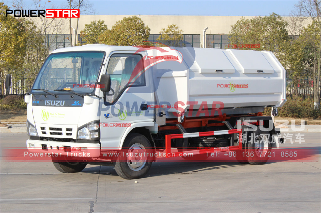 ISUZU NKR 4-6cbm camion élévateur à crochet chariot détachable camion à ordures exportation vers St Martin
